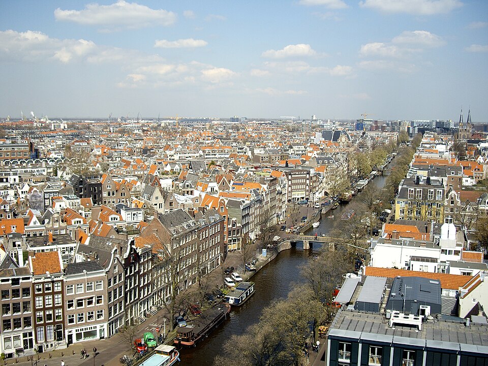 Amsterdam skyline view with canals and rooftops - Netherlands job opportunities for immigrants